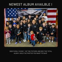 a group of people standing in front of an american flag