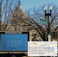 a truck is parked in front of a building