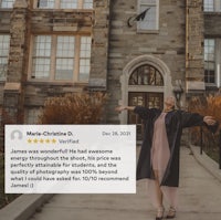 a woman is standing in front of a building with her arms outstretched