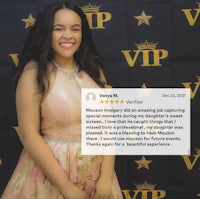 a girl in a pink dress standing in front of a vip sign