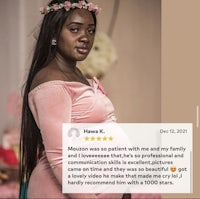 a woman in a pink dress is posing for a photo